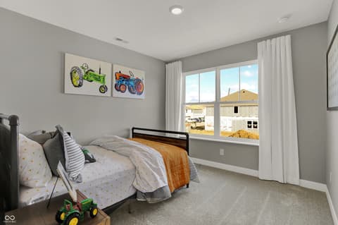 Bedroom at 15535 Postman Road, Fishers, IN — Bright bedroom with expansive windows and modern finishes.