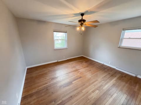 Bedroom at 10209 Broadway Street, Indianapolis, IN — Bright bedroom with hardwood floors and natural light.