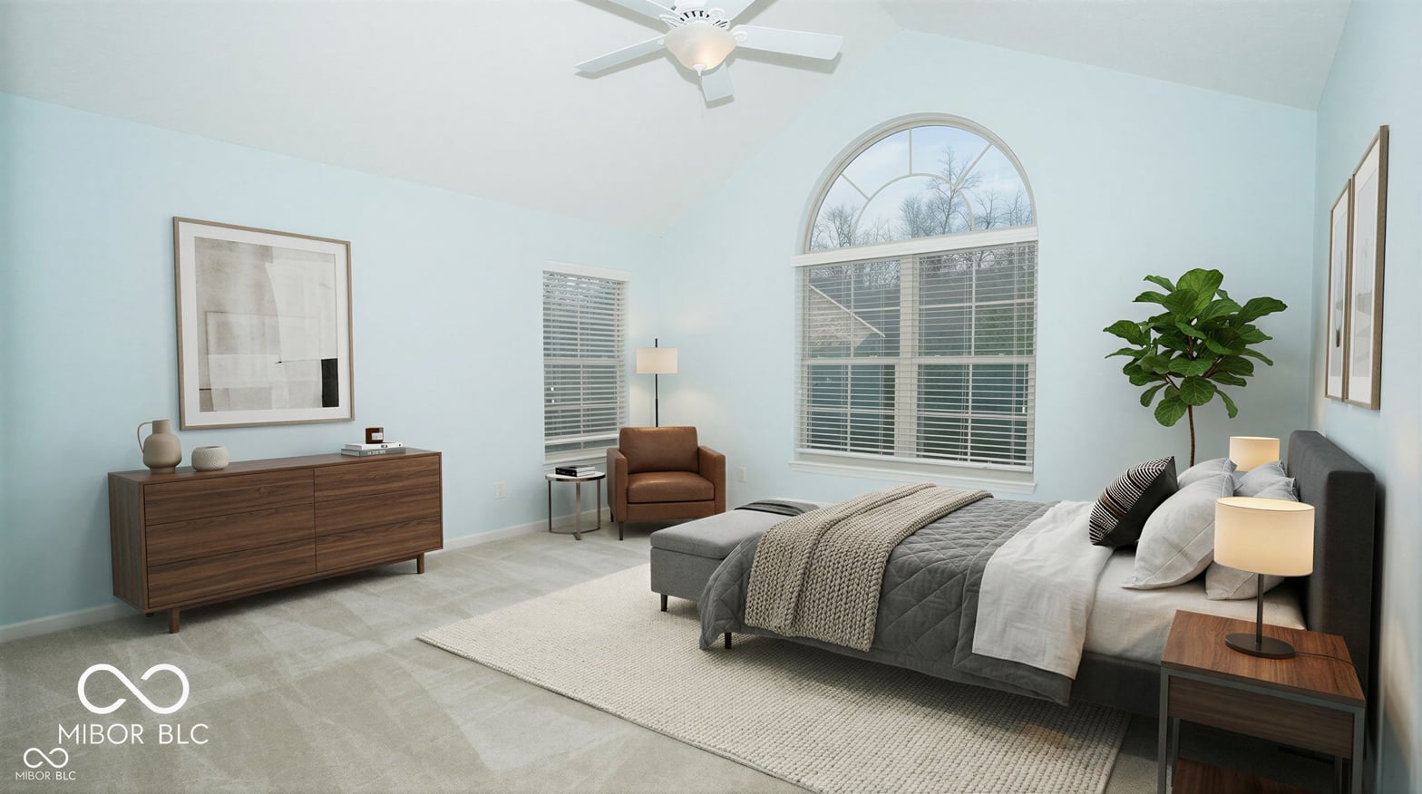 Bright primary bedroom with abundant natural light and arched windows.