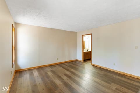 Primary bedroom at 9852 N Woodland Drive, Mooresville, IN