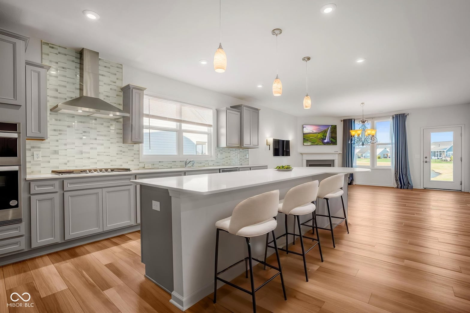 Modern open-concept kitchen with oversized island and premium finishes.