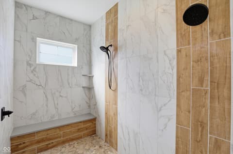 Primary bathroom at 17112 Sanders Farm Circle, Westfield, IN — Luxurious spa-style walk-in shower with premium finishes.