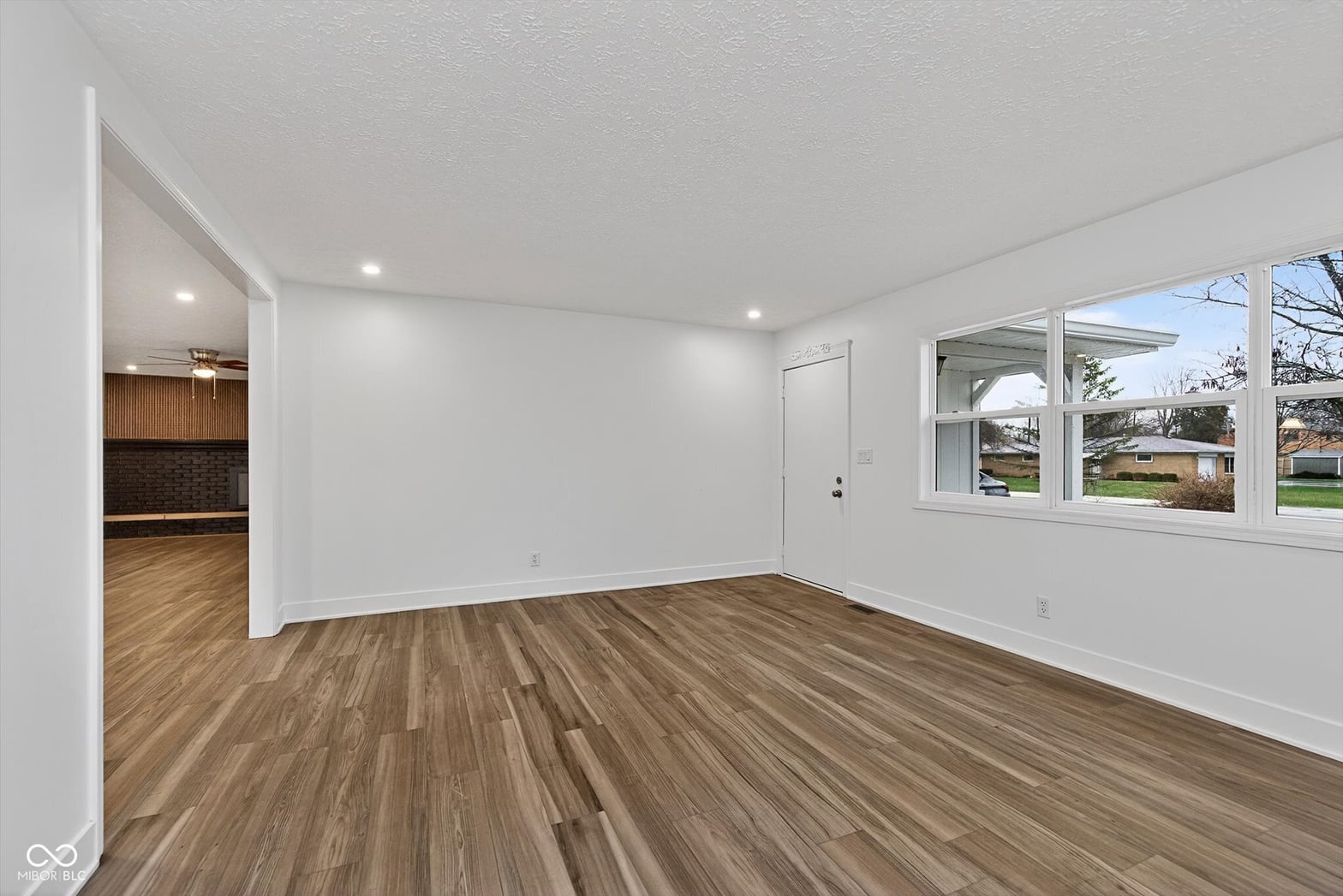 Bright, spacious renovated living area with modern finishes.