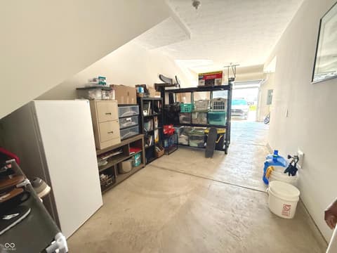 Garage at 518 Gilder Drive, Carmel, IN — Spacious garage with vaulted ceiling and abundant storage.