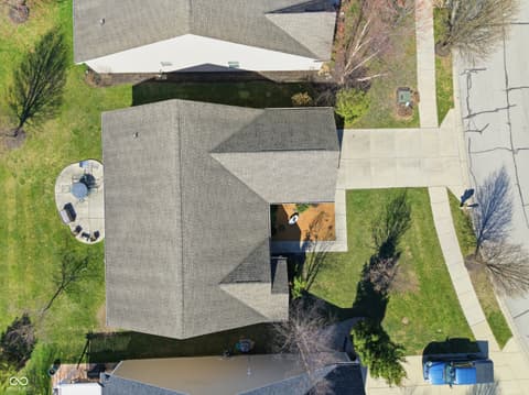 Aerial view at 9704 Brook Wood Drive, McCordsville, IN — Well-maintained contemporary home with mature landscaping.