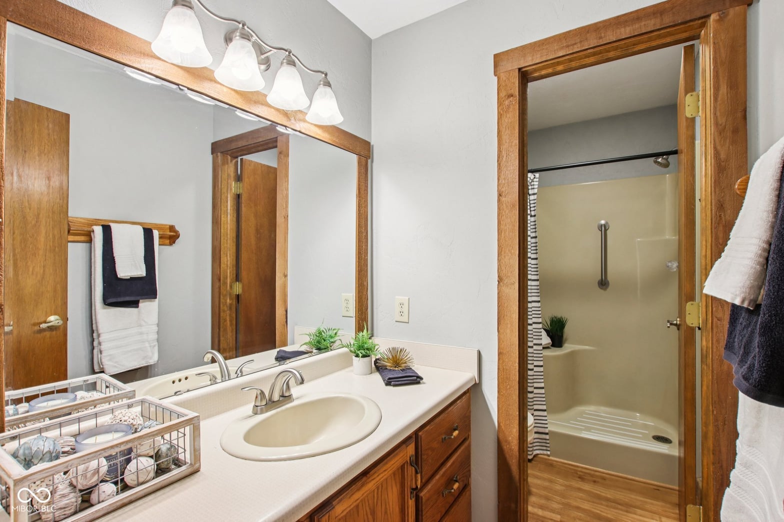 Spacious primary bath with dual vanity and walk-in shower.