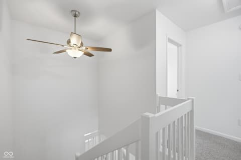 Hallway at 12706 Brewton Street, Fishers, IN — Bright, clean hallway with modern ceiling fan and lighting.