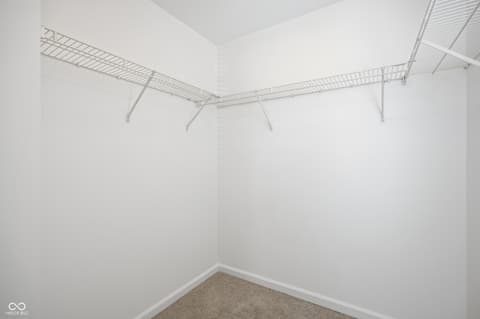 Closet at 12706 Brewton Street, Fishers, IN — Spacious walk-in closet with organized wire shelving system.