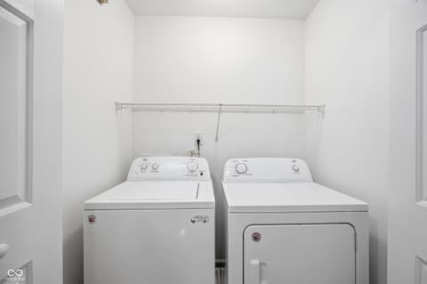 Laundry room at 12706 Brewton Street, Fishers, IN — Bright, clean laundry room with modern appliances.