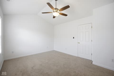 Bedroom at 12706 Brewton Street, Fishers, IN — Bright, clean bedroom with ceiling fan and closet.
