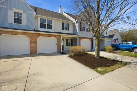 Front exterior at 12706 Brewton Street, Fishers, IN — Colonial home with two-car garage and manicured landscaping.
