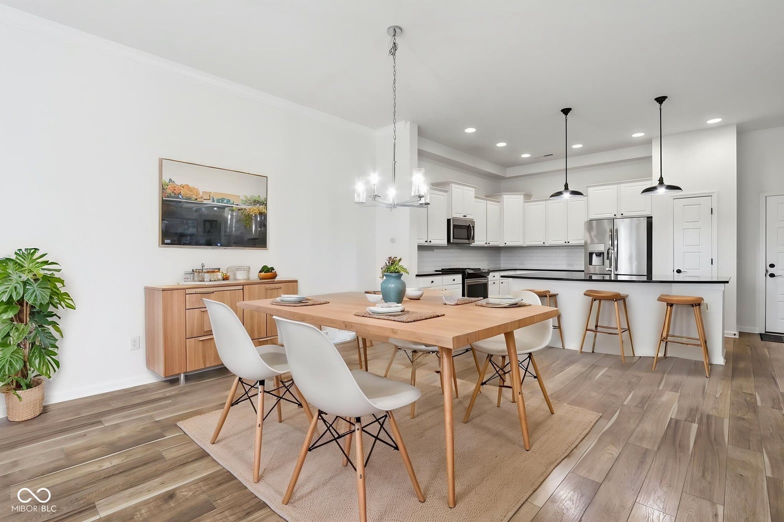 Bright open-concept dining and kitchen with modern finishes.