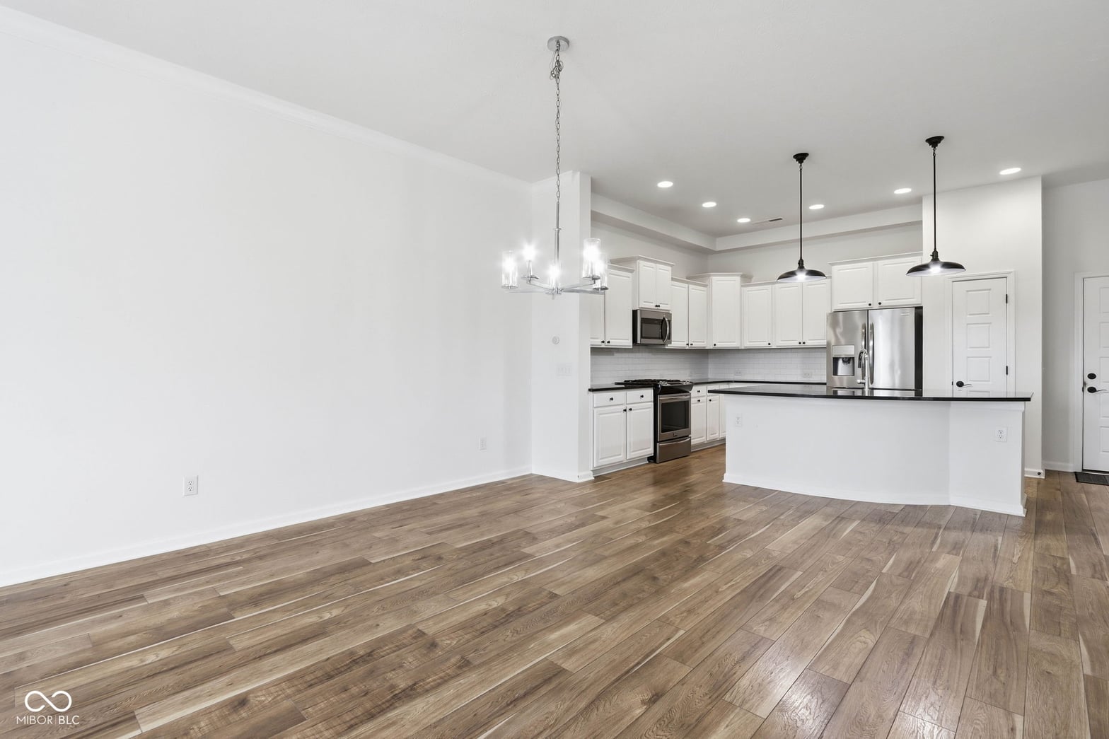 Bright open-concept kitchen with modern finishes and appliances.