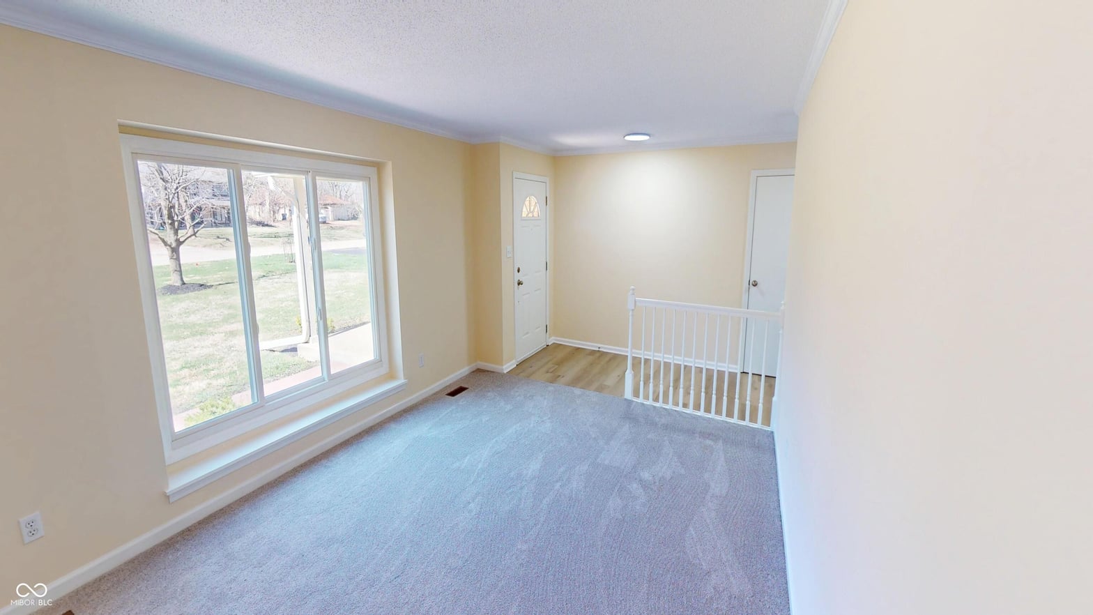 Bright family room with expansive views and natural light.