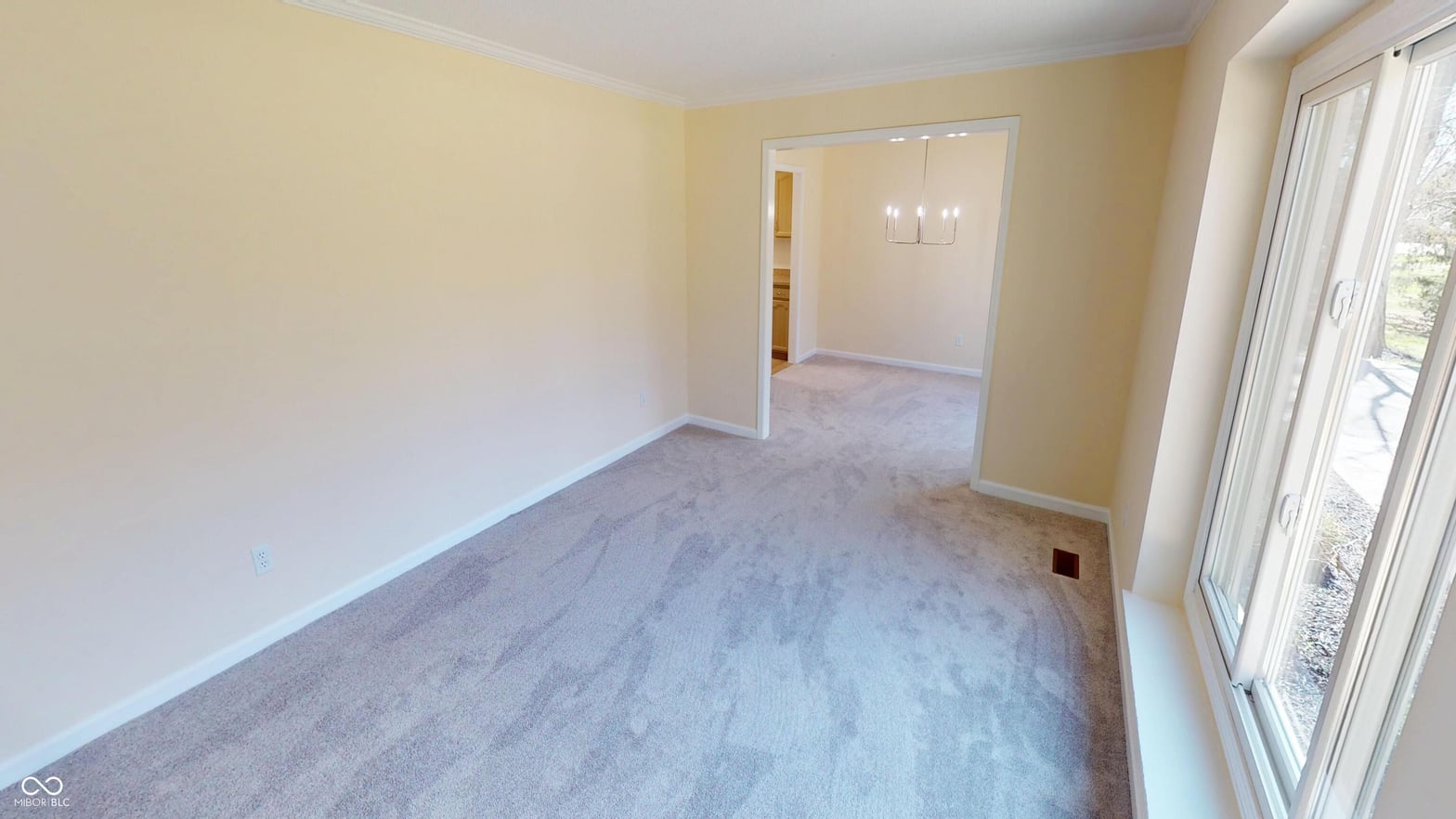 Bright, spacious living area with natural light and patio access.