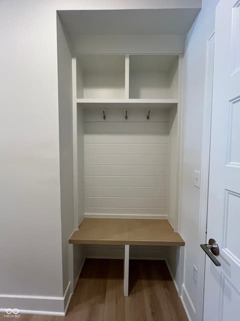 Foyer at 185 Midland Trace Loop, Westfield, IN — Custom built-in mudroom with shelving and bench seating.
