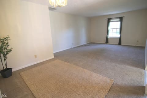 Living room at 104 Apple Tree Court, Fishers, IN — Bright, spacious living room with abundant natural light.