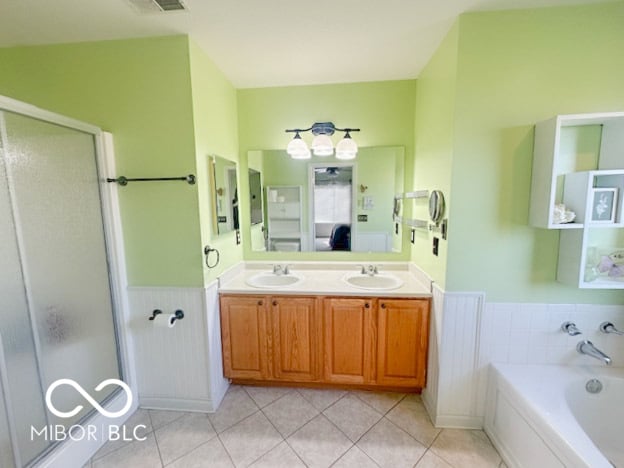 Spacious primary bath with double vanity and soaking tub.