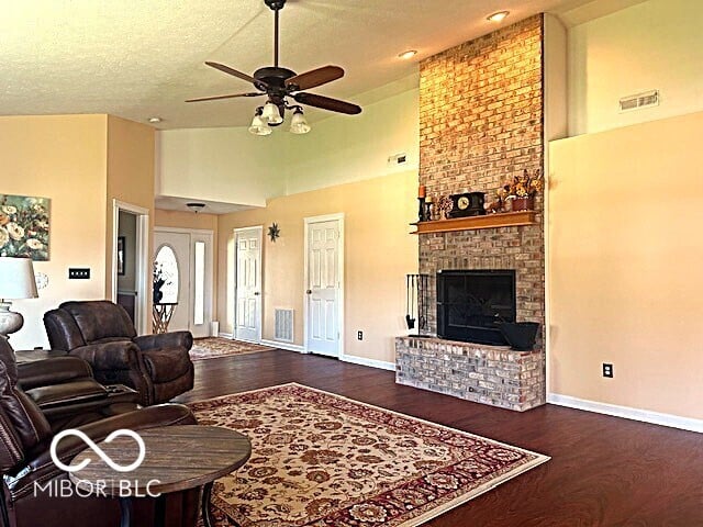 Spacious living room with impressive brick fireplace.