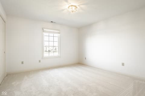 Bedroom at 2444 Laurel Lake Boulevard, Carmel, IN — Bright, spacious bedroom with excellent natural light.