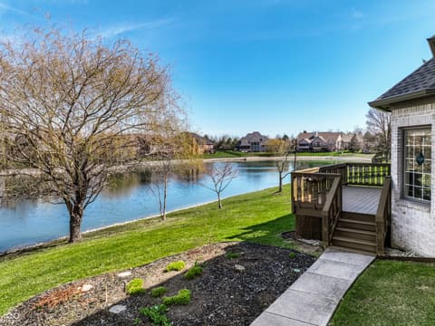 Backyard at 2444 Laurel Lake Boulevard, Carmel, IN — Stunning waterfront home with private lake views and deck.