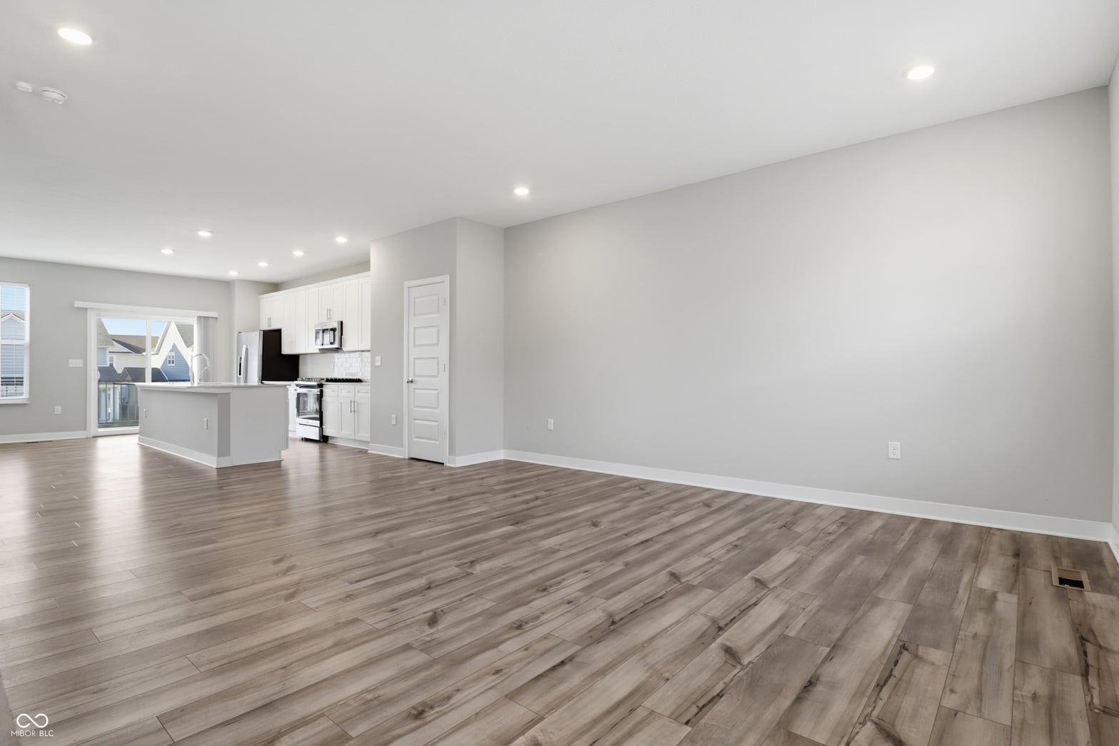 Bright modern living space with open kitchen layout.