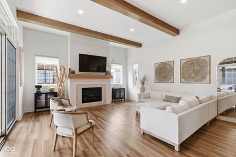Living room at 1541 Cantata Lane, Westfield, IN — Bright living room with exposed beams and fireplace.