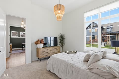 Primary bedroom at 1541 Cantata Lane, Westfield, IN — Bright primary suite with ensuite and modern furnishings.