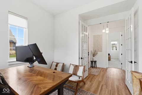 Home office at 1541 Cantata Lane, Westfield, IN — Bright modern office with hardwood floors and natural light.