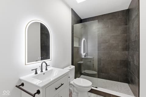 Primary bathroom at 1541 Cantata Lane, Westfield, IN — Spa-like primary bath with modern fixtures and skylight.