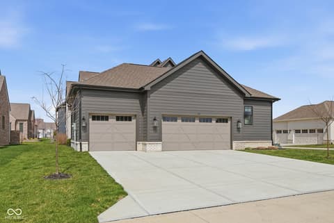 Front exterior at 1541 Cantata Lane, Westfield, IN — Modern home with three-car garage and clean design.