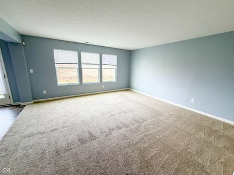 Living room at 3366 Firethorn Drive, Whitestown, IN