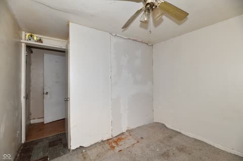 Bedroom at 214 Tippecanoe Drive, Noblesville, IN — Spacious bedroom needing cosmetic updates and finishing.