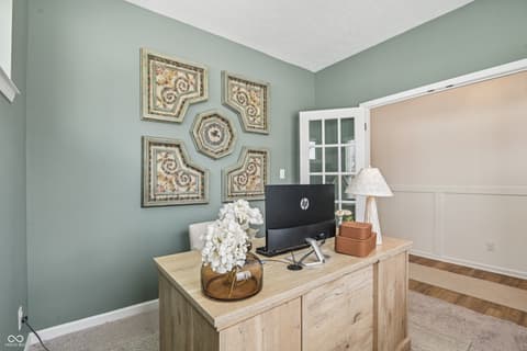 Home office at 82 Hovden Drive, Cicero, IN — Elegant home office with sophisticated sage green accents.