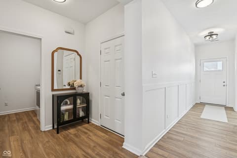 Foyer at 82 Hovden Drive, Cicero, IN — Bright, updated foyer with elegant wainscoting and storage.