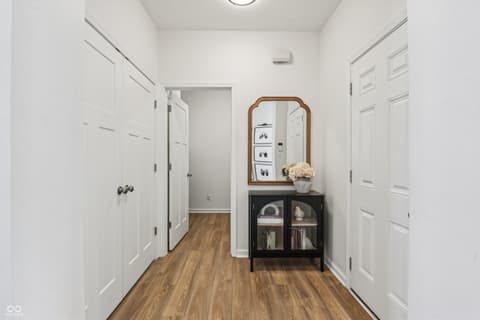 Hallway at 82 Hovden Drive, Cicero, IN — Bright hallway with hardwood floors and modern finishes.