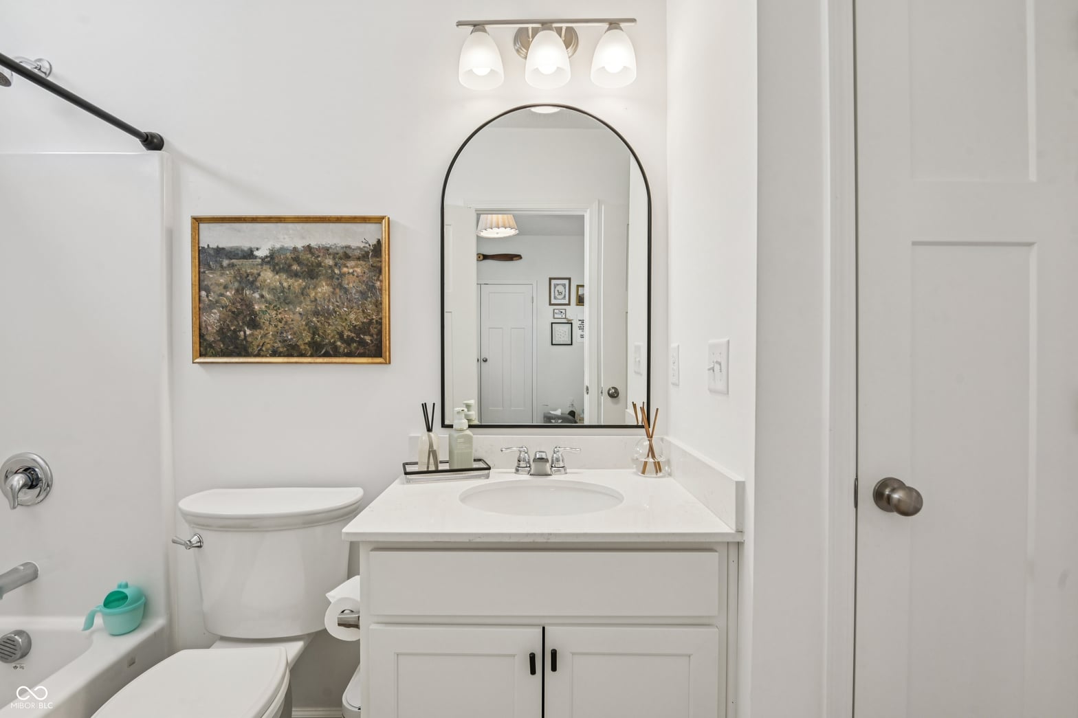 Primary bathroom at 82 Hovden Drive, Cicero, IN — Bright, updated primary bath with arched mirror and vanity.