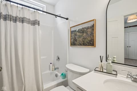 Primary bathroom at 82 Hovden Drive, Cicero, IN — Bright primary bath with dual vanity and soaking tub.