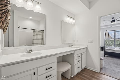 Primary bathroom at 82 Hovden Drive, Cicero, IN — Luxurious primary bath with dual vanities and makeup area