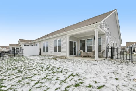 Backyard at 82 Hovden Drive, Cicero, IN — Spacious beachside patio with covered seating area.