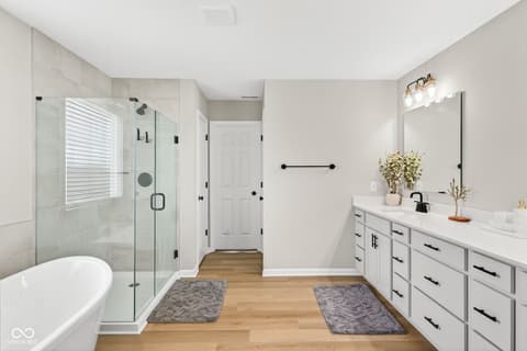 Primary bathroom at 12338 French Cattle Way, Noblesville, IN — Luxurious primary bath with spa-like finishes throughout.