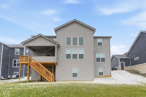 Backyard at 12338 French Cattle Way, Noblesville, IN — Modern two-story home with covered deck and spacious yard.