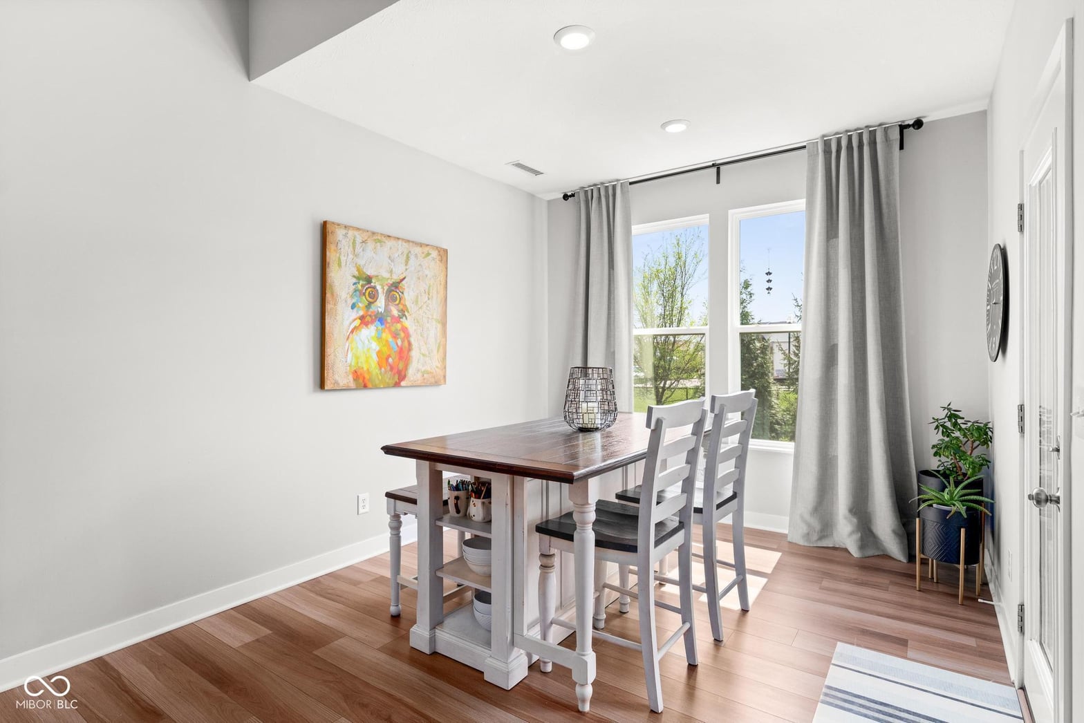 Bright farmhouse dining with direct patio access.