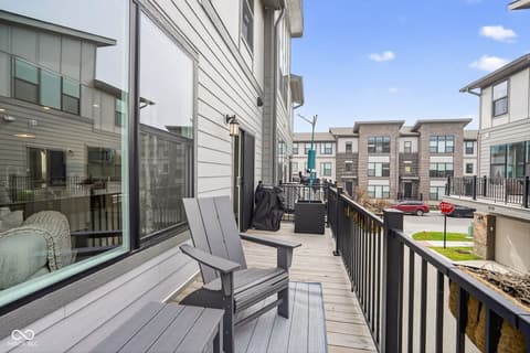 Outdoor living area at 11571 Huffington Street, Carmel, IN — Modern composite deck with urban neighborhood views.
