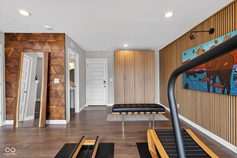 Basement at 11571 Huffington Street, Carmel, IN — Finished basement with modern gym and entertainment space.