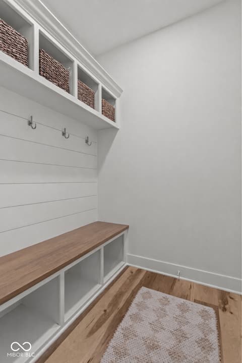 Foyer at 96 Cedar Lane, Cicero, IN — Bright mudroom with built-in storage and shiplap walls.