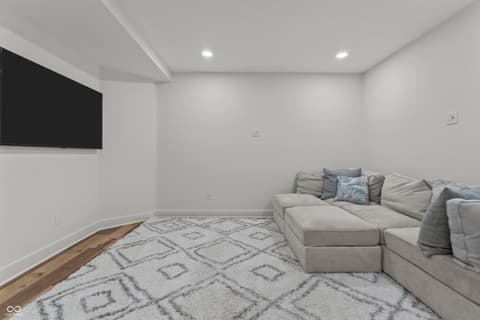 Bonus room at 96 Cedar Lane, Cicero, IN — Bright modern bonus room with media setup and hardwood.