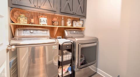 Laundry room at 6583 Apperson Drive, Noblesville, IN — Modern laundry room with premium stainless steel appliances.