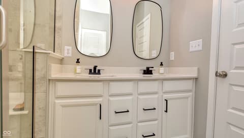 Primary bathroom at 6583 Apperson Drive, Noblesville, IN — Elegant primary bath with dual vanity and modern finishes.