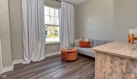 Bedroom at 6583 Apperson Drive, Noblesville, IN — Bright bedroom with expansive windows and modern finishes.
